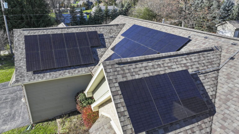A rooftop aerial view of solar panels on a roof